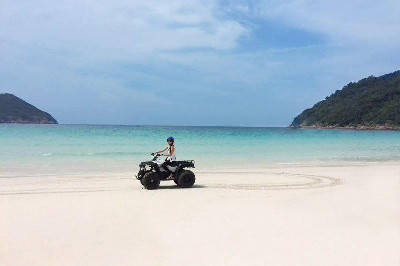 riding an atv on beach redang