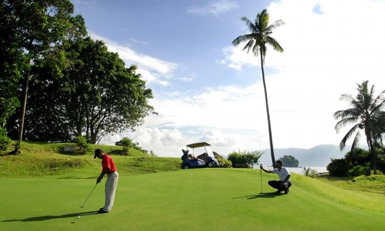 Berjaya Tioman Resort's impressive 18-hole golf course with a scenic view of the island