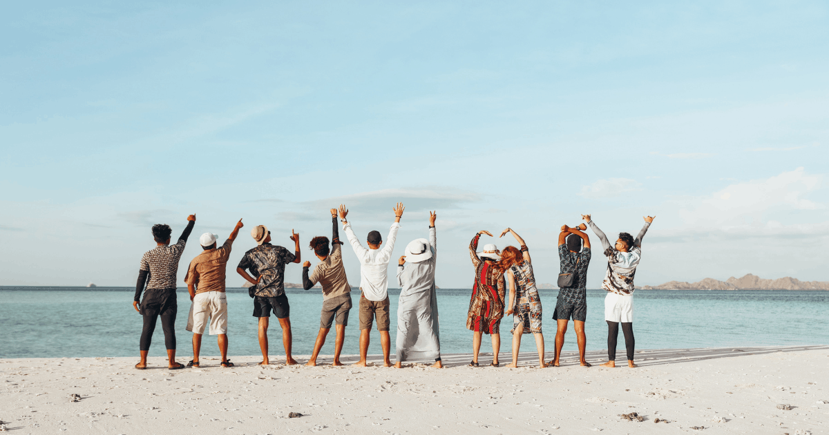 group jumping aesthetically on a beach